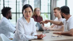 a group of young business people consider a business prenup in the form of a buy sell agreement
